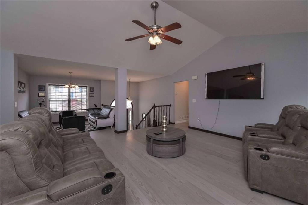 113 Millwheel Drive Villa Rica, GA 30180 - Photo 8 of 34 a living room with furniture and a flat screen tv