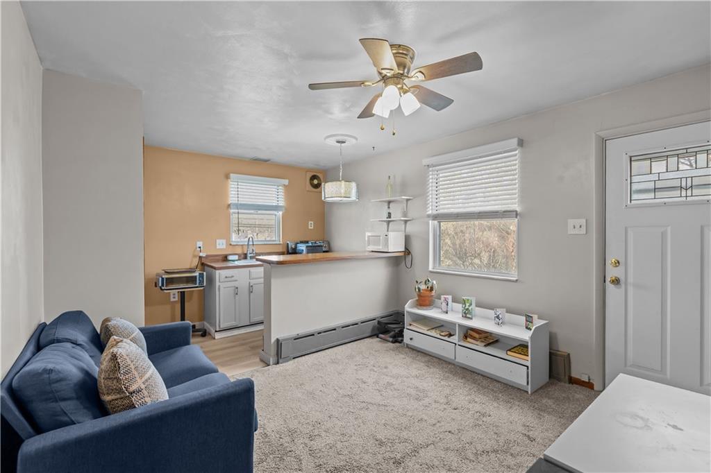 300 Highland Road Pittsburgh, PA 15235 - Photo 14 of 32 a living room with furniture and kitchen view