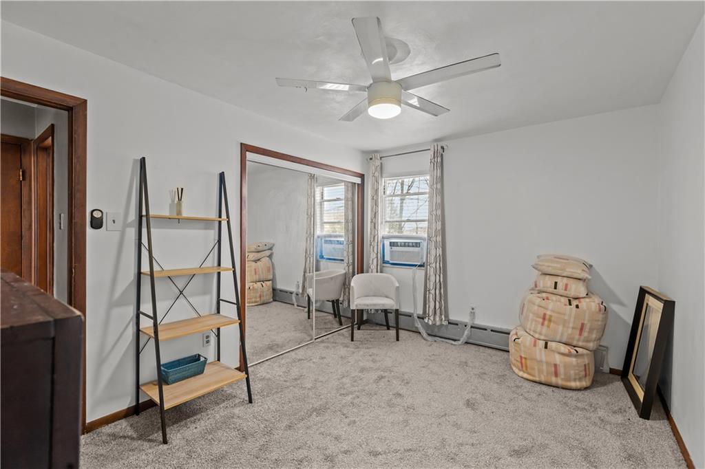 300 Highland Road Pittsburgh, PA 15235 - Photo 15 of 32 a living room with furniture and a chandelier