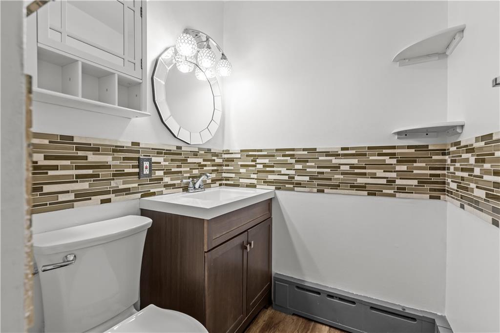 300 Highland Road Pittsburgh, PA 15235 - Photo 16 of 32 a bathroom with a sink and a mirror