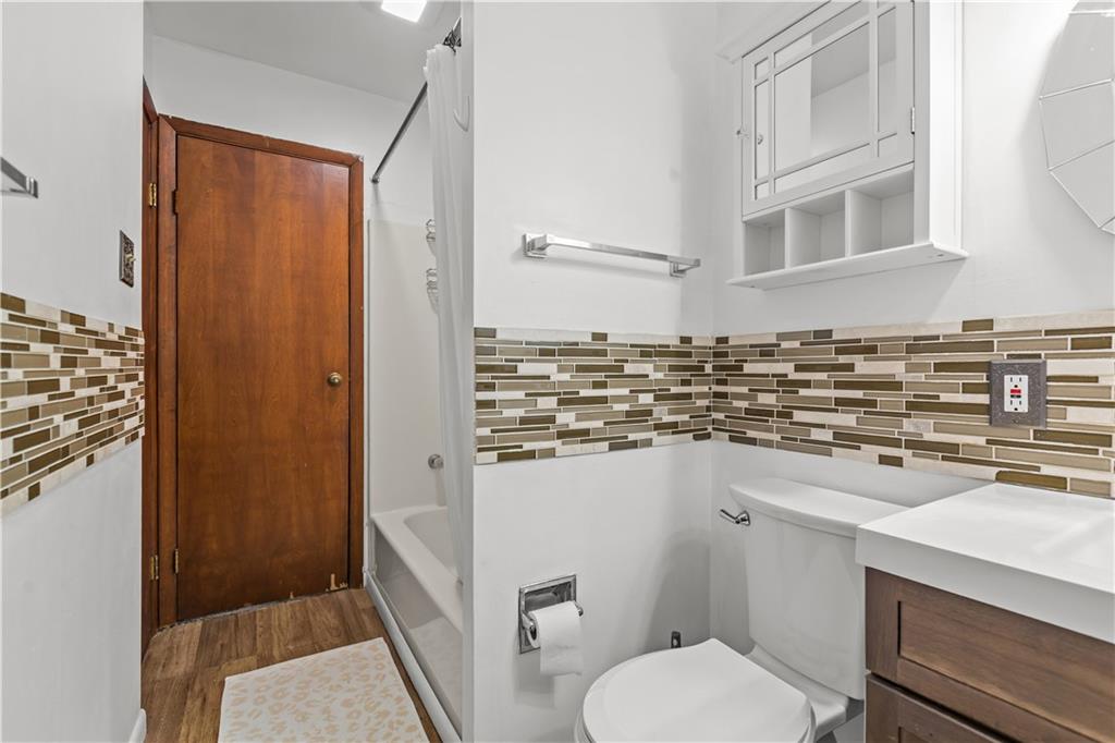 300 Highland Road Pittsburgh, PA 15235 - Photo 17 of 32 a bathroom with a sink a toilet and shower