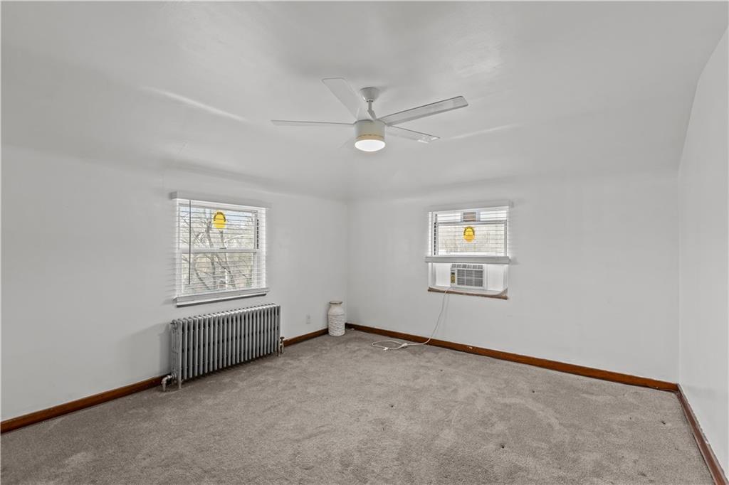 300 Highland Road Pittsburgh, PA 15235 - Photo 21 of 32 an empty room with windows and closet
