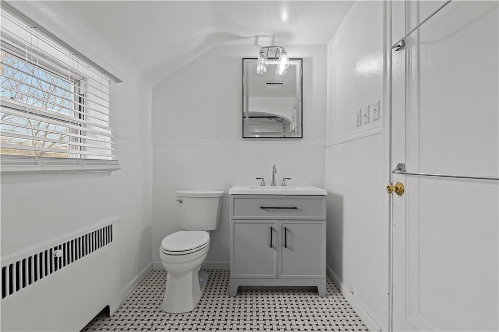 300 Highland Road Pittsburgh, PA 15235 - Photo 23 of 32 a bathroom with a sink a toilet and a mirror