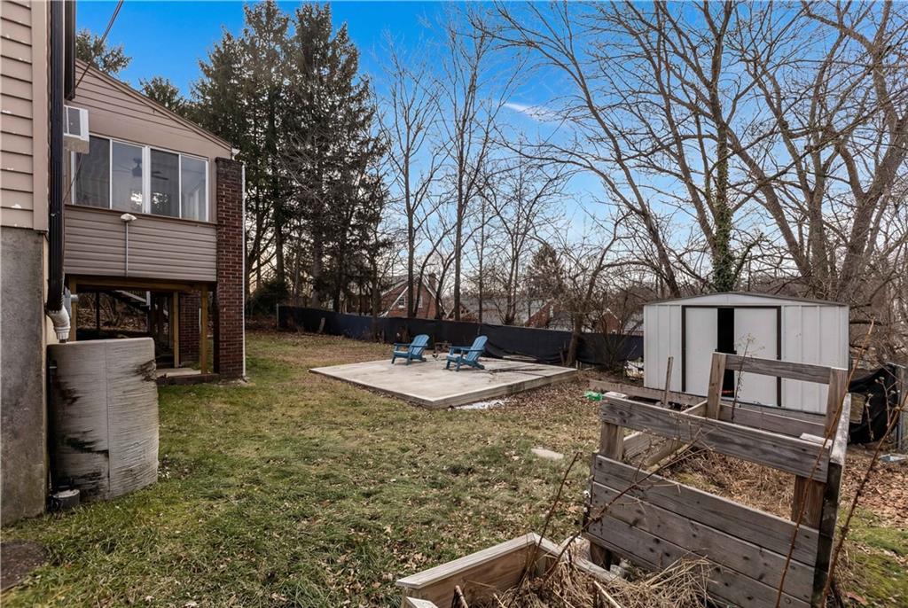 300 Highland Road Pittsburgh, PA 15235 - Photo 31 of 32 a view of a backyard with a large tree