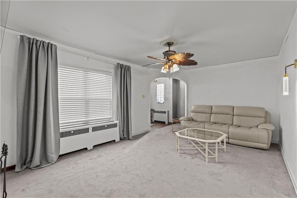 300 Highland Road Pittsburgh, PA 15235 - Photo 4 of 32 a living room with furniture and a chandelier