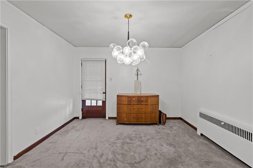 300 Highland Road Pittsburgh, PA 15235 - Photo 6 of 32 a room with a chandelier and a window