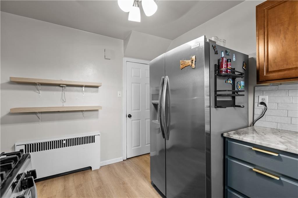 300 Highland Road Pittsburgh, PA 15235 - Photo 10 of 32 a kitchen with stainless steel appliances granite countertop a refrigerator and a stove top oven