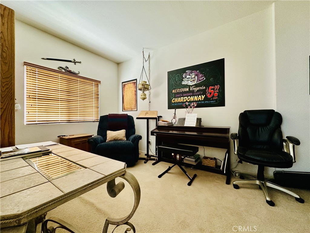1665 Ravenswood Road Beaumont, CA 92223 - Photo 8 of 41 a work room with furniture and a window