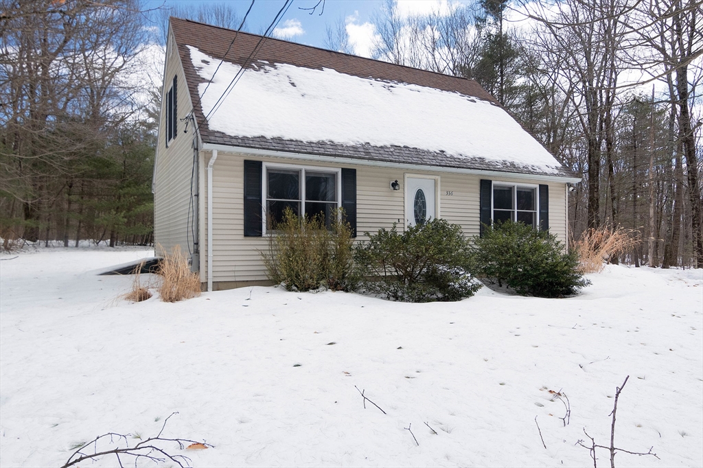 336 Pommogussett Road Rutland, MA 01543 - Photo 1 of 31 a view of a house with a yard covered in snow