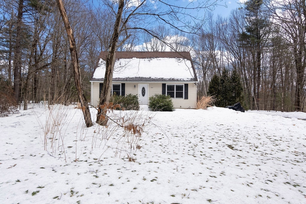 336 Pommogussett Road Rutland, MA 01543 - Photo 4 of 31 a view of a house with a yard covered in snow