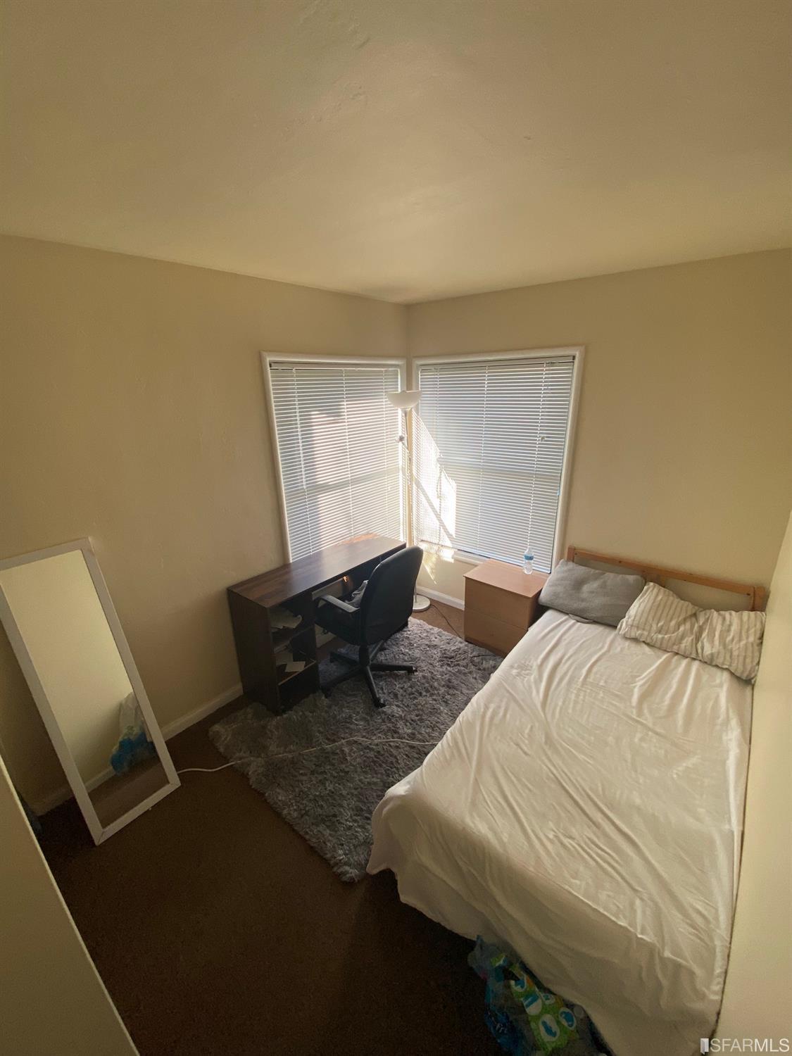 2127-2143 Dwight Way Berkeley, CA 94704 - Photo 38 of 39 a bedroom with a bed and window