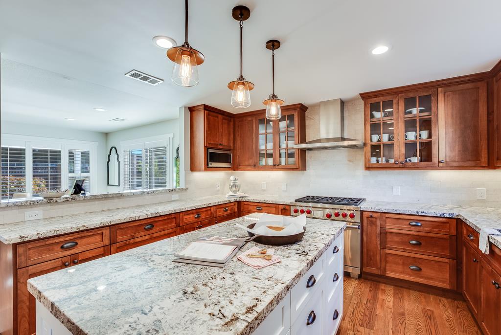 811 West Homestead Road Sunnyvale, CA 94087 - Photo 13 of 33 a kitchen with stainless steel appliances granite countertop a sink a stove and a wooden floors