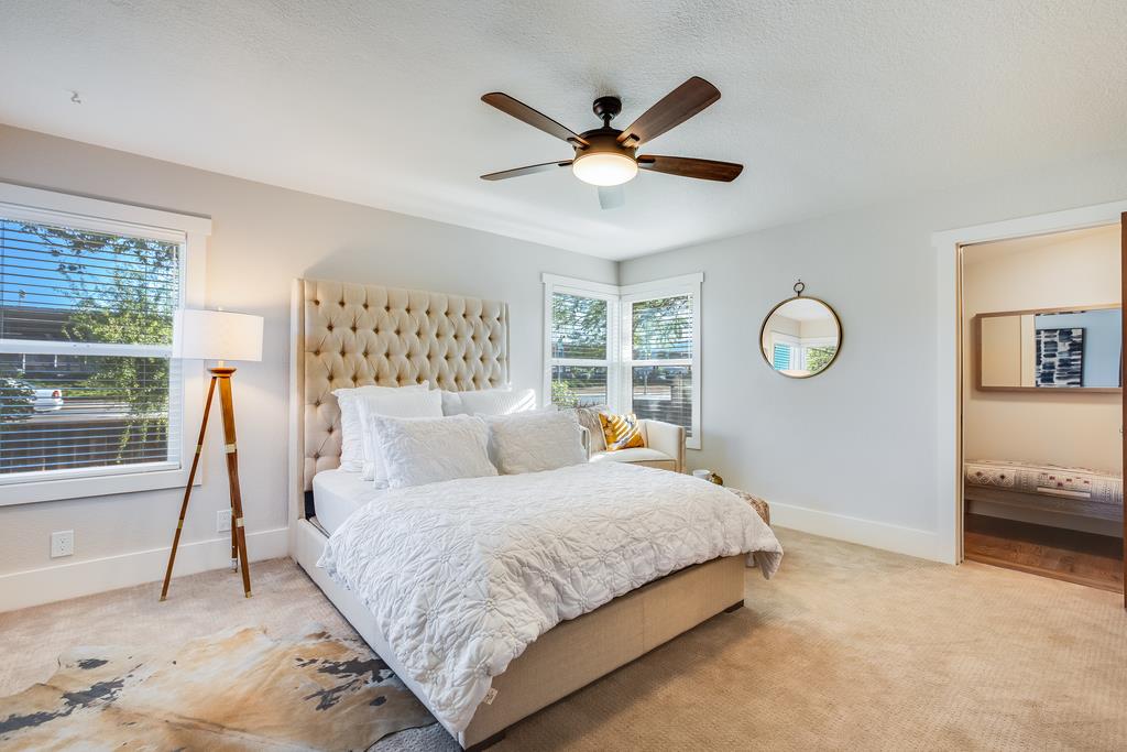 811 West Homestead Road Sunnyvale, CA 94087 - Photo 16 of 33 a bedroom with a large bed and a chandelier