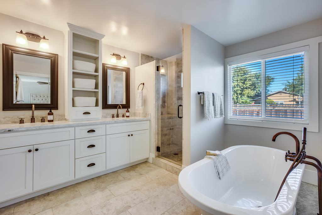 811 West Homestead Road Sunnyvale, CA 94087 - Photo 18 of 33 a spacious bathroom with double vanity a mirror a bathtub and a shower