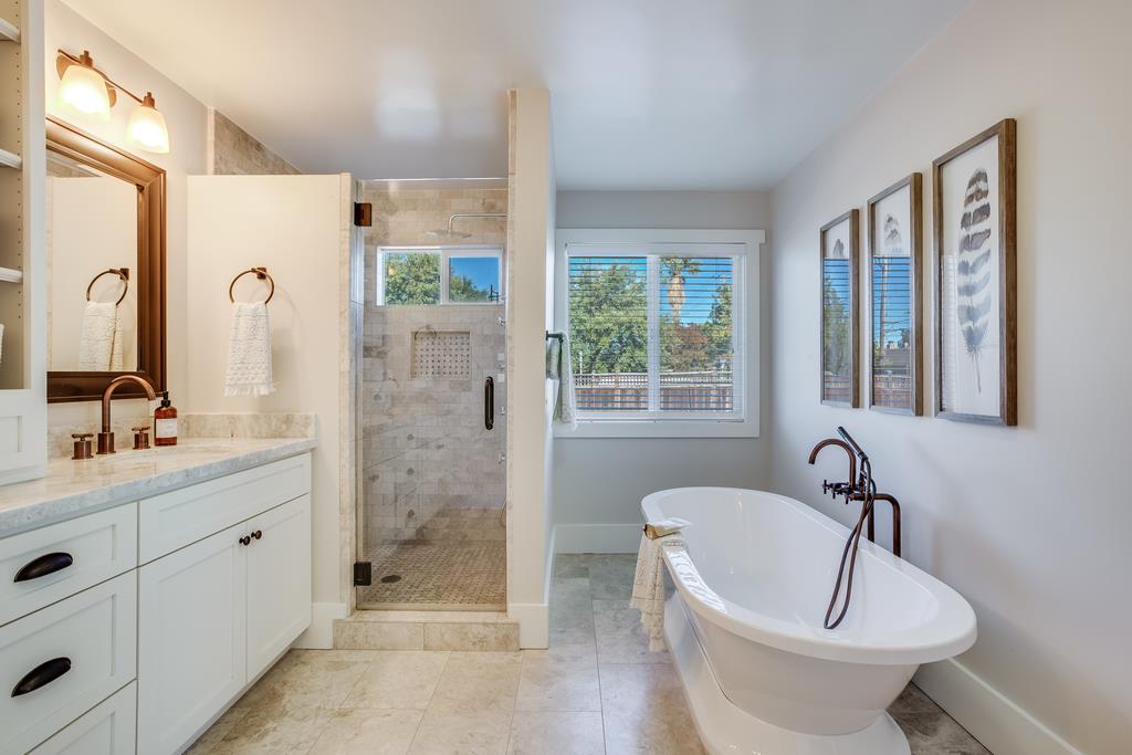 811 West Homestead Road Sunnyvale, CA 94087 - Photo 19 of 33 a bathroom with a bathtub shower sink mirror and toilet