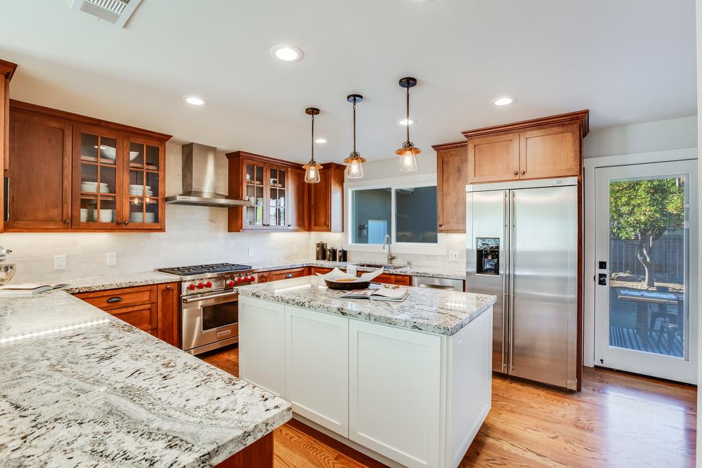 811 West Homestead Road Sunnyvale, CA 94087 - Photo 8 of 33 a kitchen with stainless steel appliances granite countertop a sink stove refrigerator and cabinets