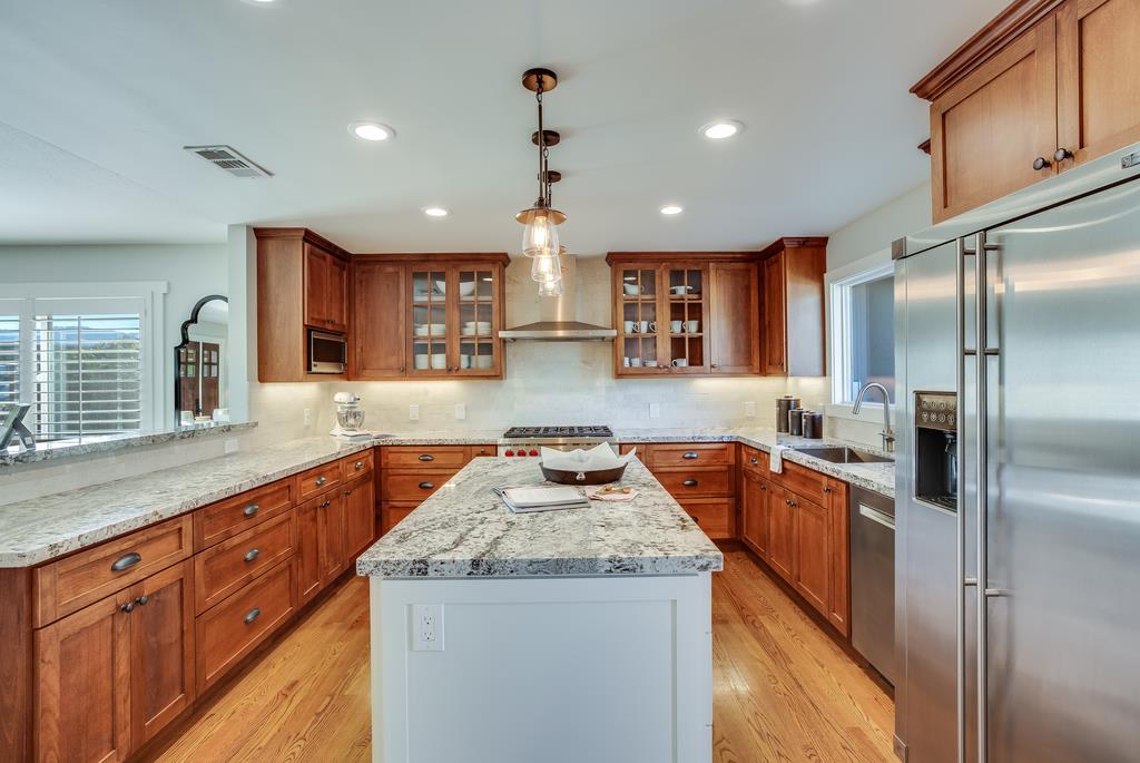 811 West Homestead Road Sunnyvale, CA 94087 - Photo 9 of 33 a kitchen with stainless steel appliances granite countertop a sink a stove and a refrigerator