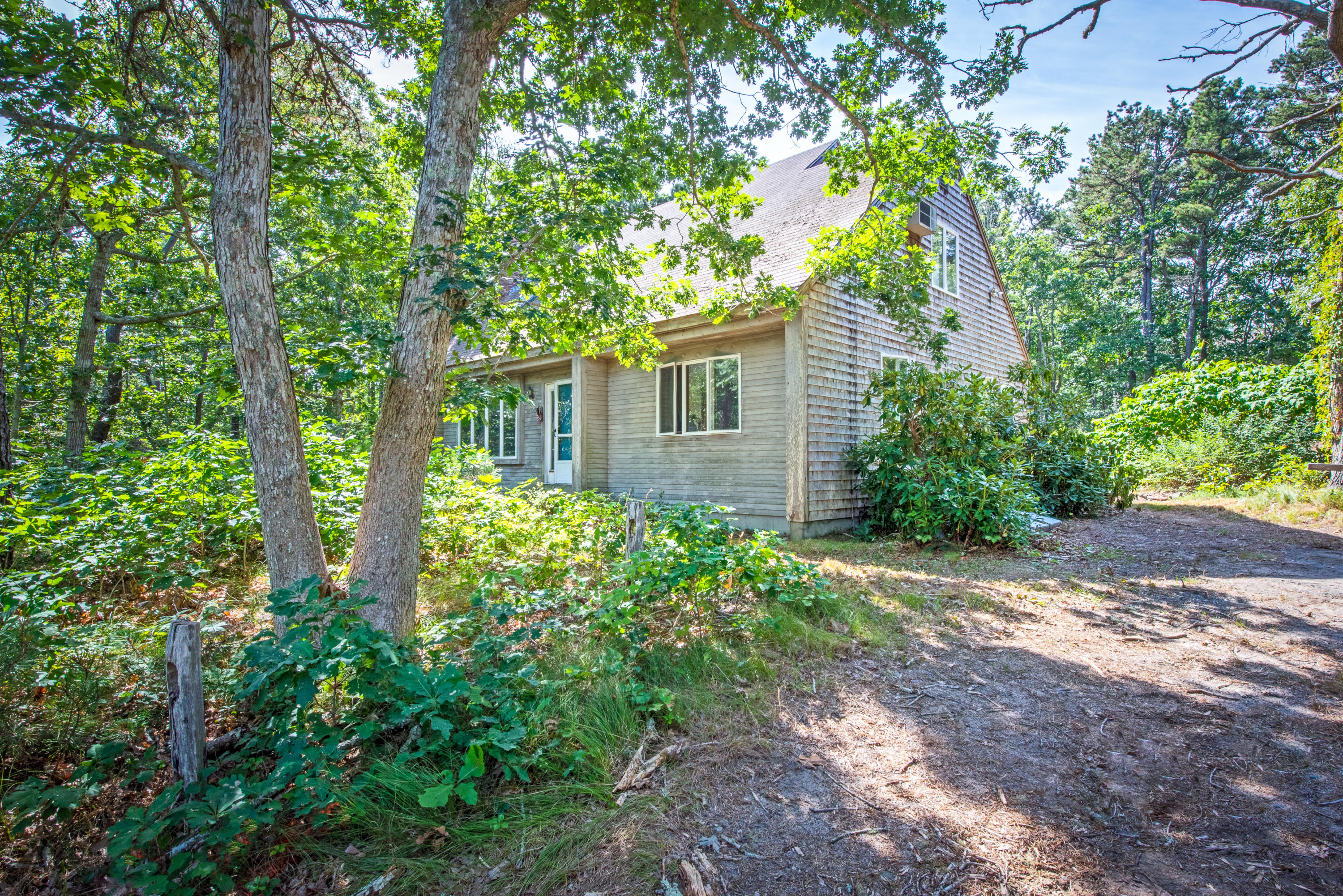 35 Oak Valley Road Wellfleet, MA 02667 - Photo 1 of 15 front view of a house with a garden