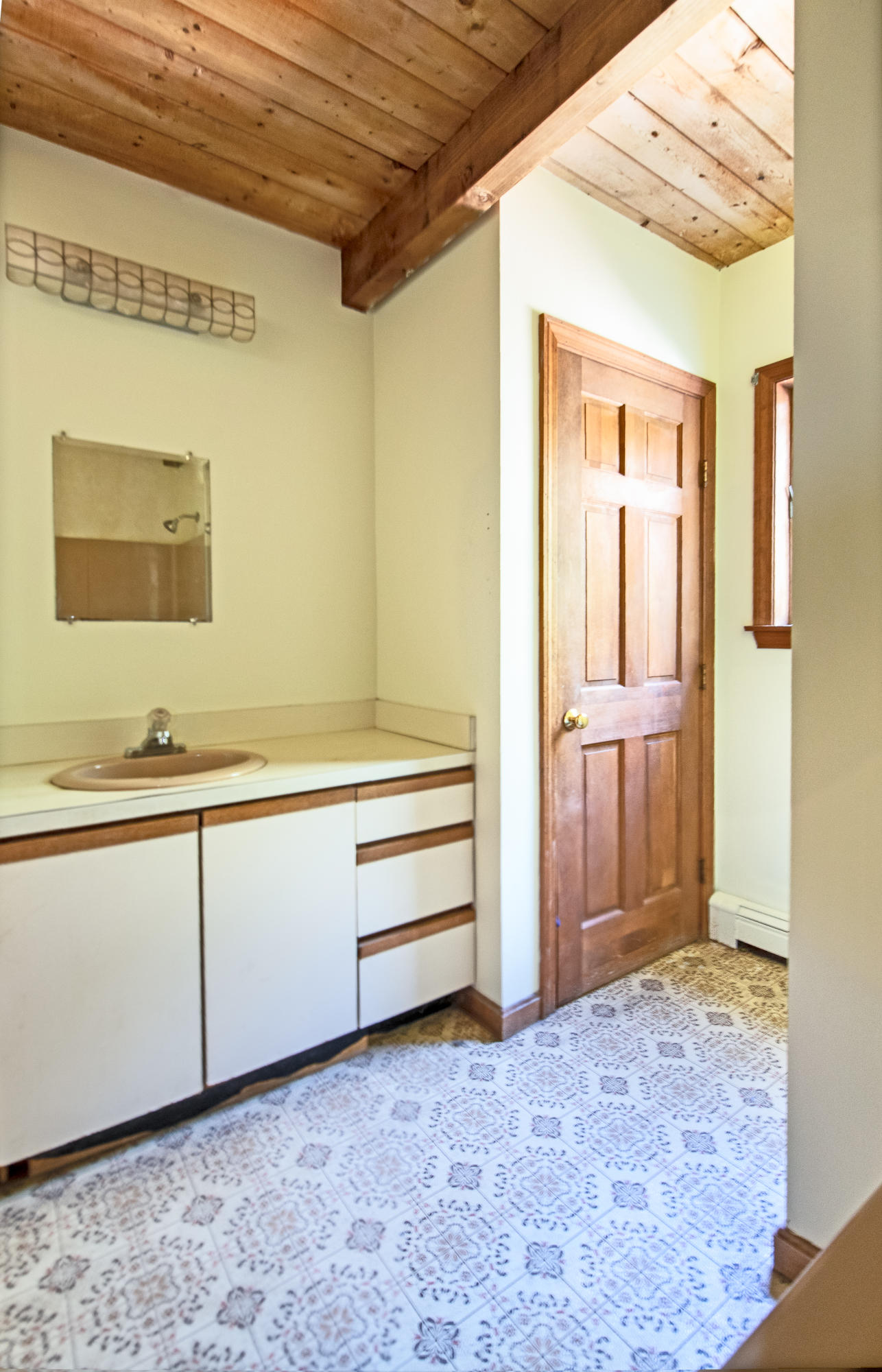 35 Oak Valley Road Wellfleet, MA 02667 - Photo 11 of 15 a bathroom with a sink and a mirror