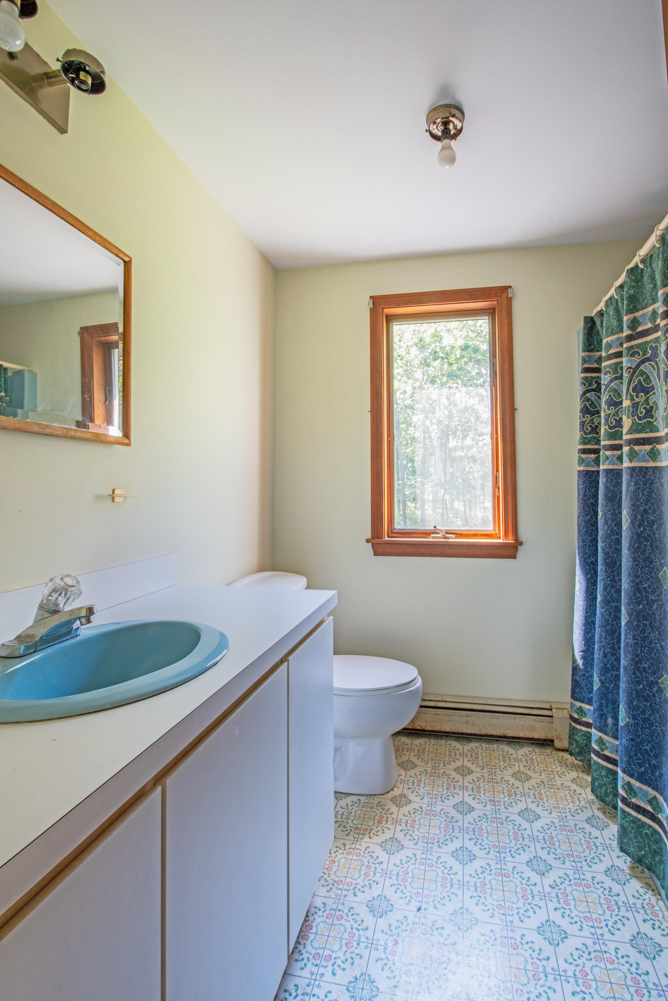 35 Oak Valley Road Wellfleet, MA 02667 - Photo 12 of 15 a bathroom with a granite countertop sink and a mirror