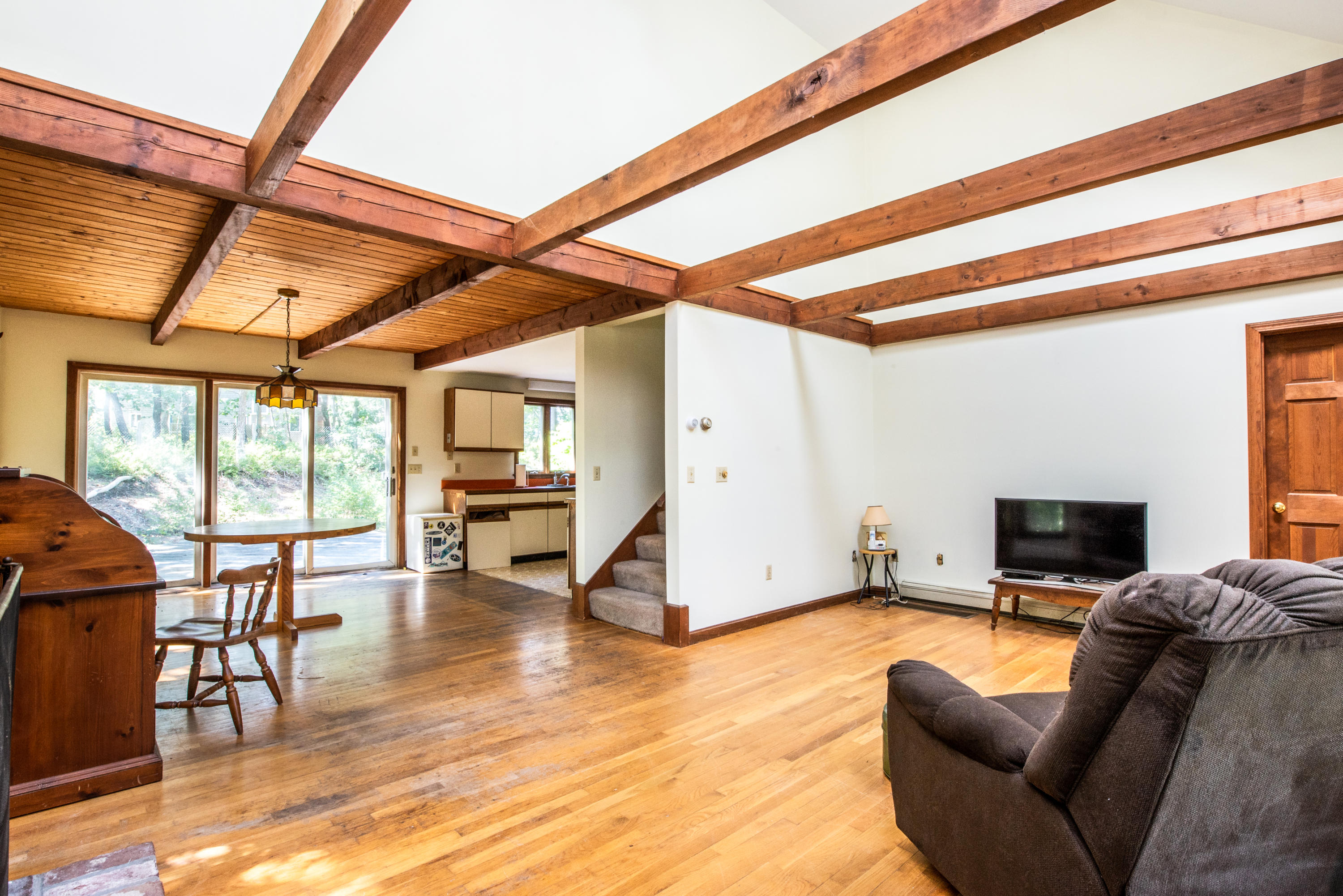 35 Oak Valley Road Wellfleet, MA 02667 - Photo 5 of 15 a living room with furniture and a flat screen tv