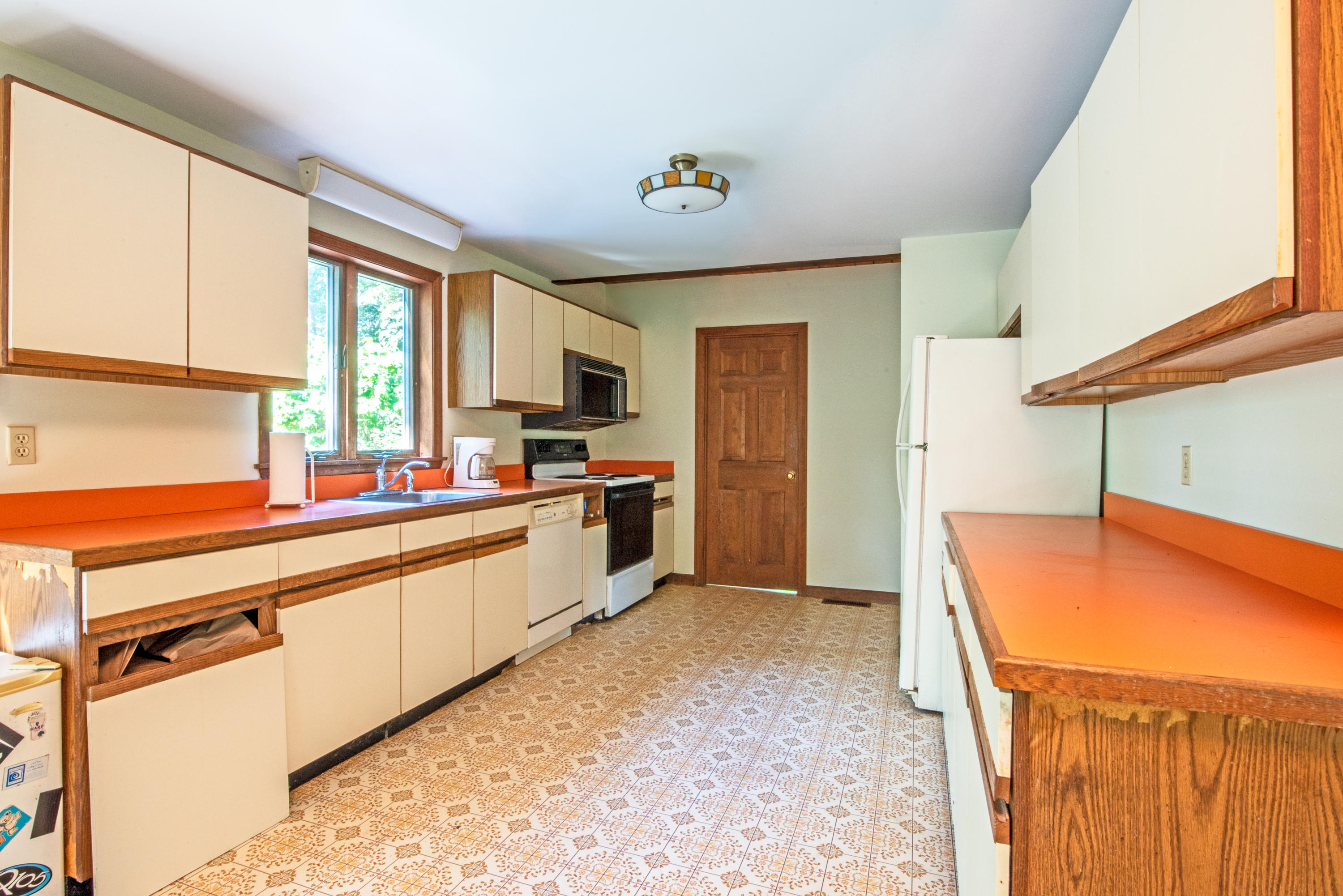 35 Oak Valley Road Wellfleet, MA 02667 - Photo 10 of 15 a kitchen with stainless steel appliances kitchen island sink refrigerator and microwave