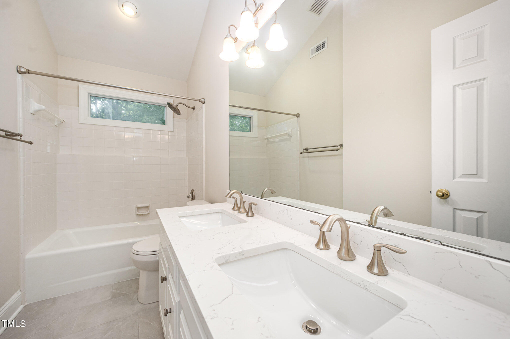 7605 Sandy Lake Court Raleigh, NC 27613 - Photo 20 of 51 Renovated hallway bath on second floor.
