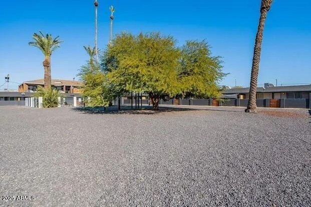 a view of a house with backyard patio and swimming pool
