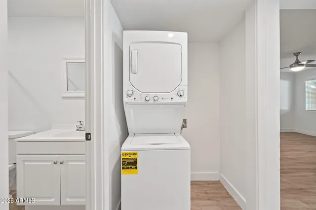 a kitchen with refrigerator and cabinets