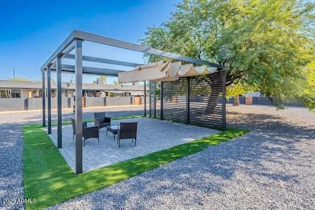 a view of a kitchen with wooden floor a sink and a refrigerator