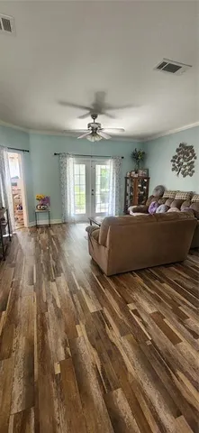 a bedroom with a large bed and a large window