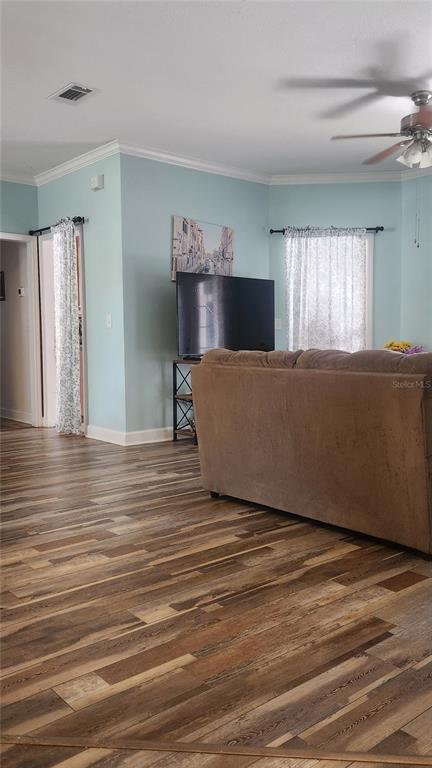 6839 Southwest 82 Terrace Gainesville, FL 32608 - Photo 4 of 28 a living room with furniture and a flat screen tv
