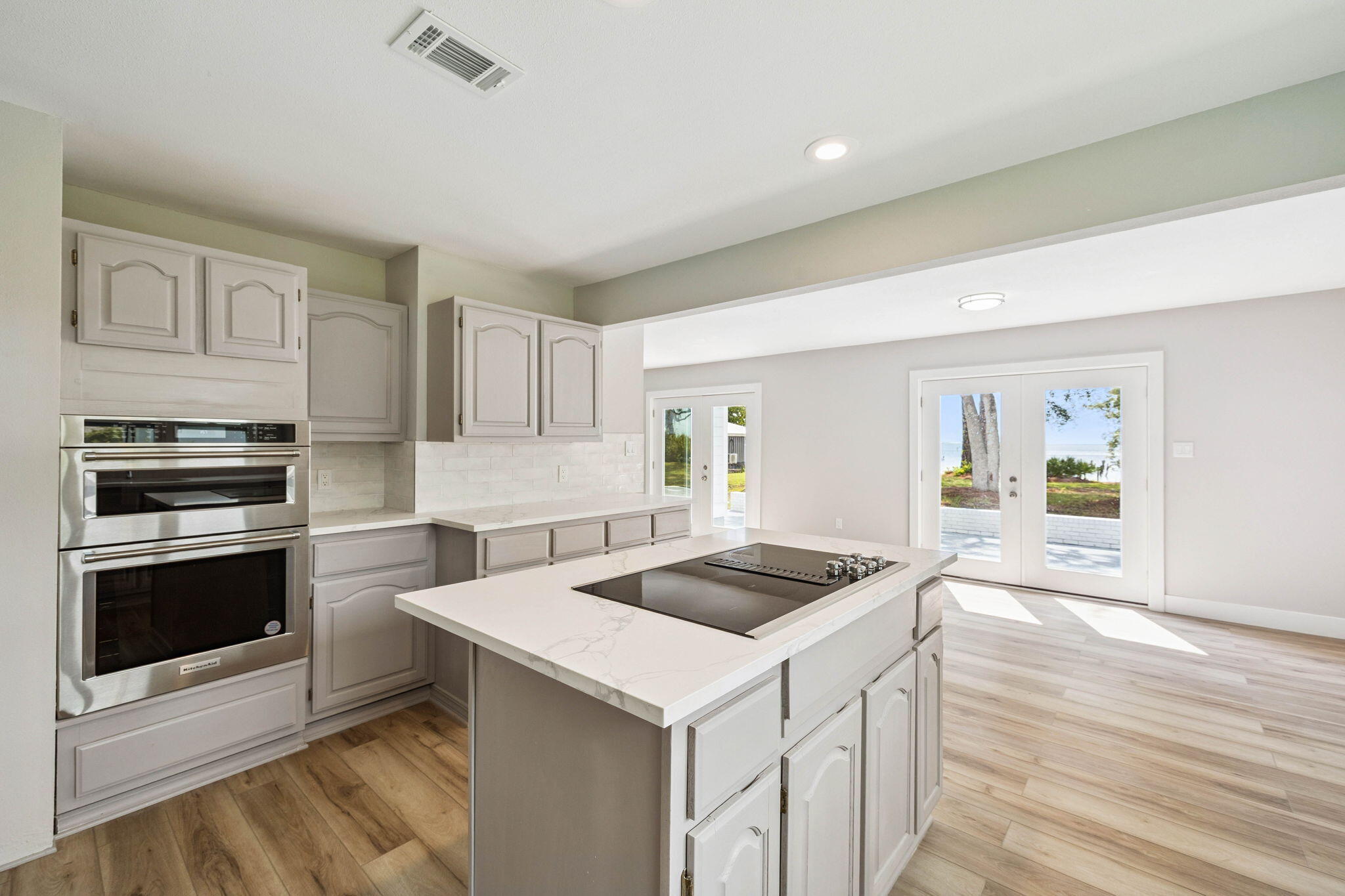 2208 Bay Grove Road Freeport, FL 32439 - Photo 17 of 70 a kitchen that has a sink and a stove top oven