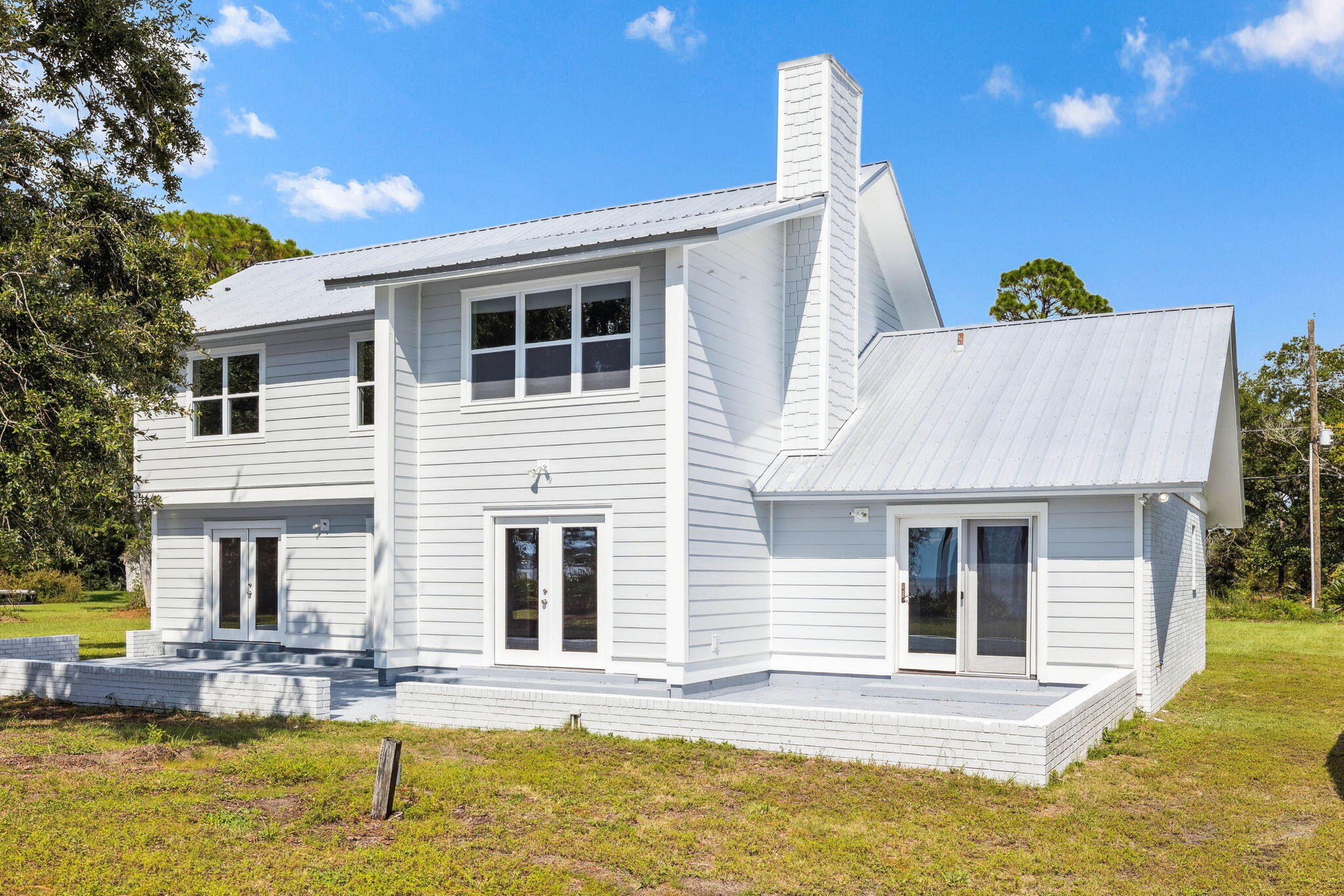 2208 Bay Grove Road Freeport, FL 32439 - Photo 25 of 70 a view of a house with swimming pool and sitting area