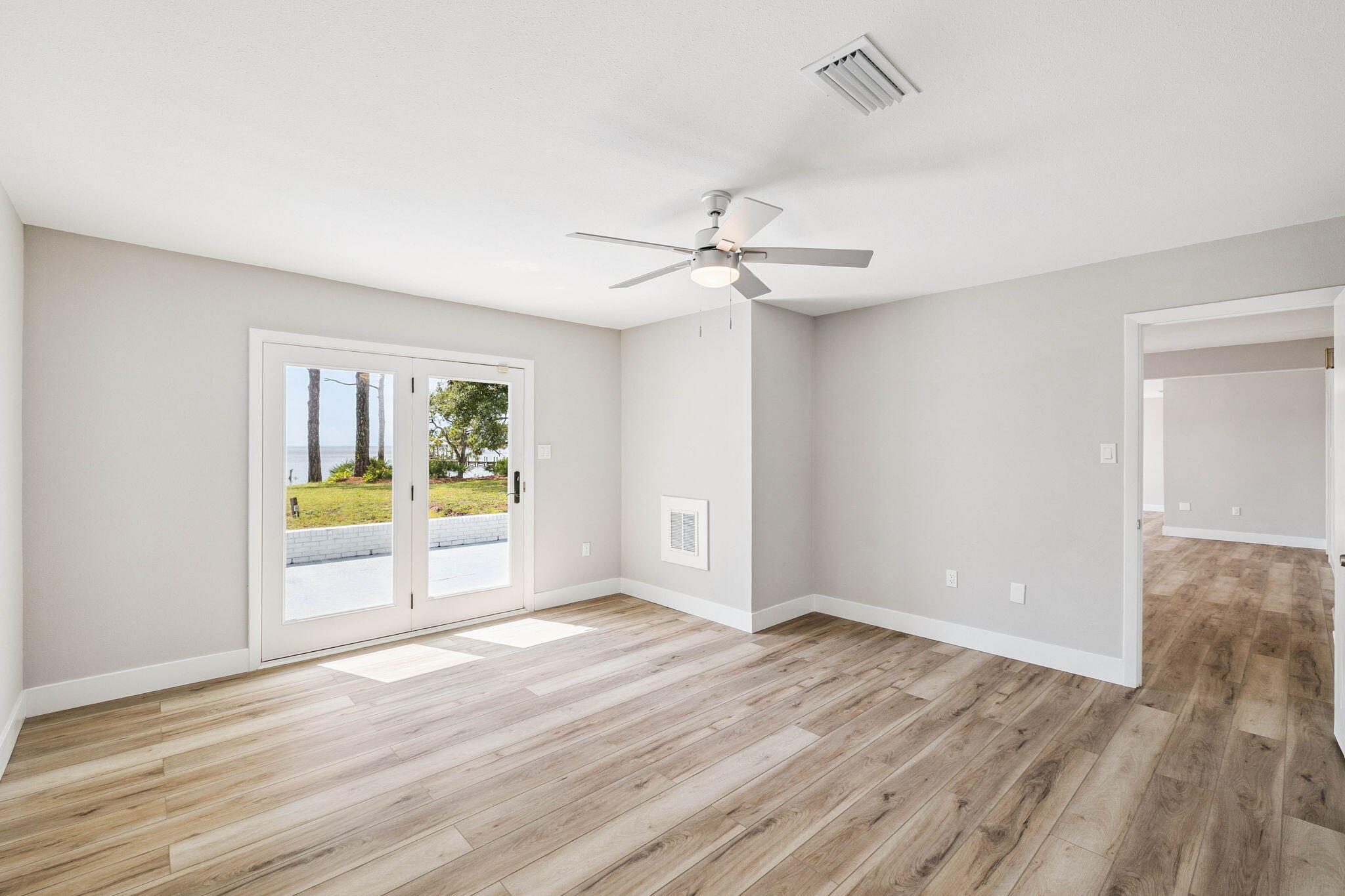 2208 Bay Grove Road Freeport, FL 32439 - Photo 36 of 70 wooden floor in an empty room with a window