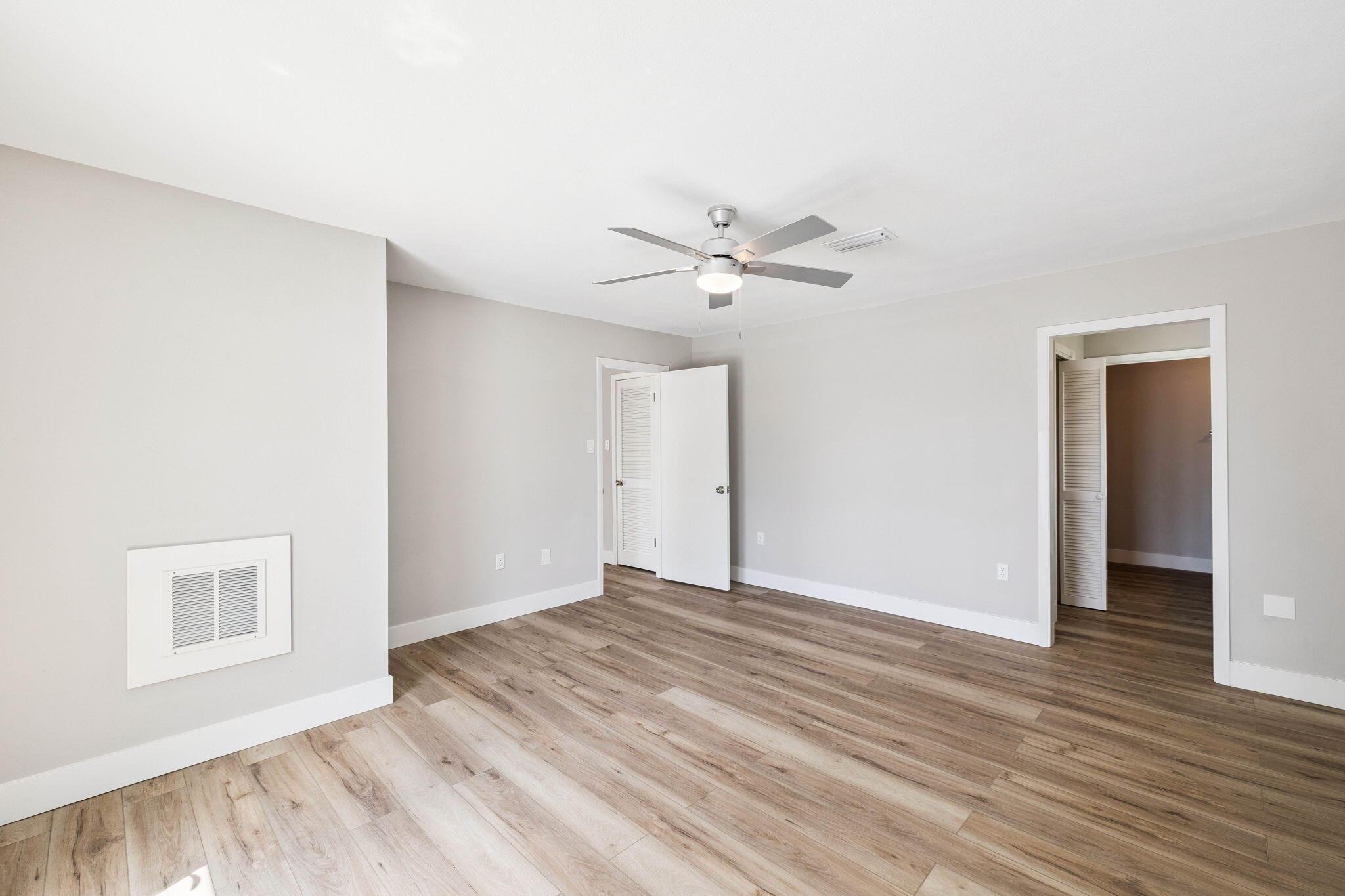 2208 Bay Grove Road Freeport, FL 32439 - Photo 37 of 70 a view of an empty room with wooden floor
