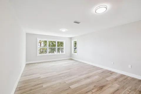 a aerial view of a house with a yard and sitting space