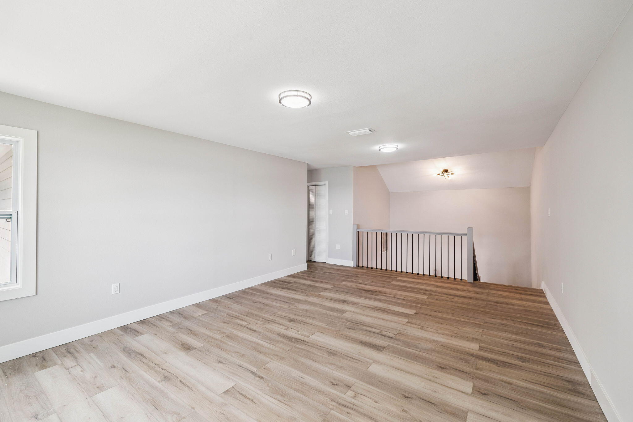 2208 Bay Grove Road Freeport, FL 32439 - Photo 49 of 70 a view of an empty room with wooden floor
