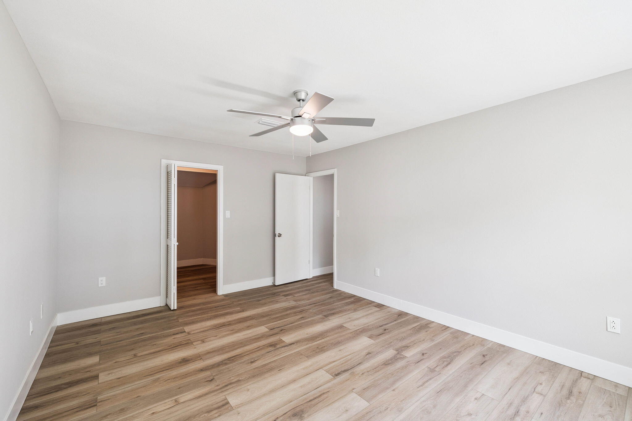 2208 Bay Grove Road Freeport, FL 32439 - Photo 56 of 70 a view of an empty room with wooden floor