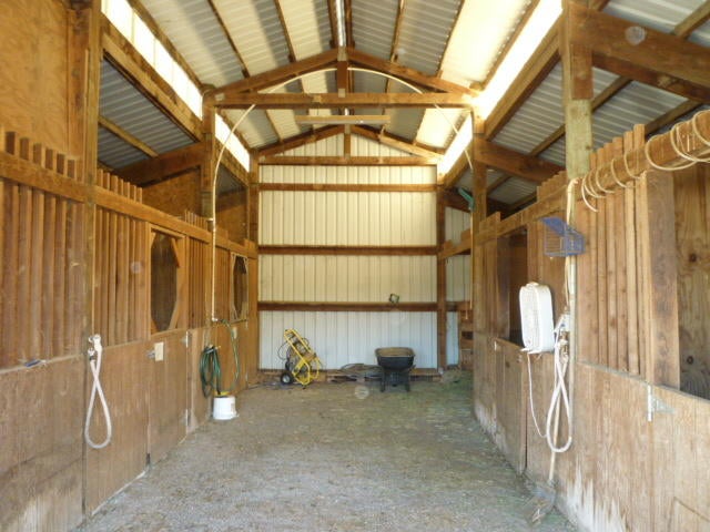 205 Latigo Ranch Road Williams, OR 97544 - Photo 40 of 50 4 full stalls, large hay storage and lockable tack room