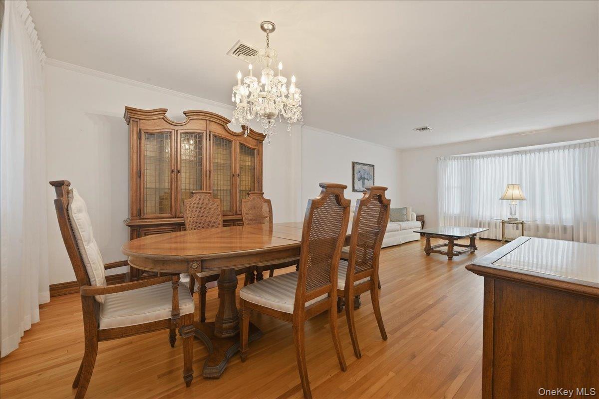17 Avon Road Farmingdale, NY 11735 - Photo 6 of 46 a view of a dining room with furniture and chandelier