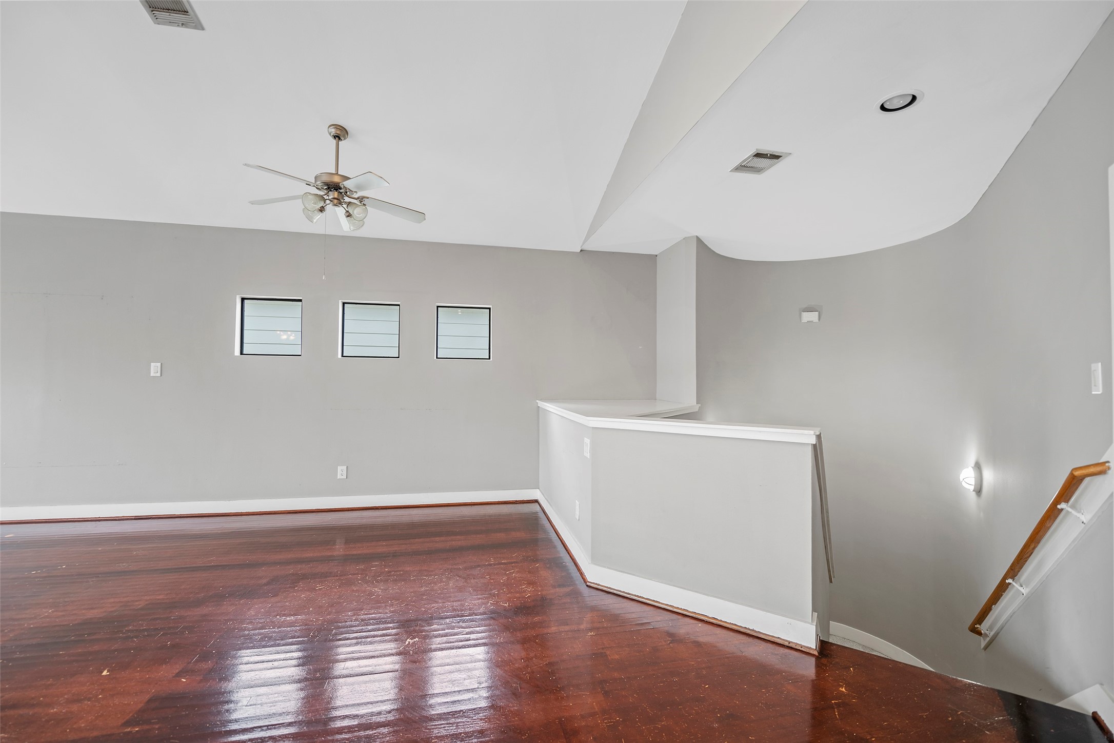 9705 Linkmeadow Lane Houston, TX 77025 - Photo 14 of 32 a view of room with window and wooden floor