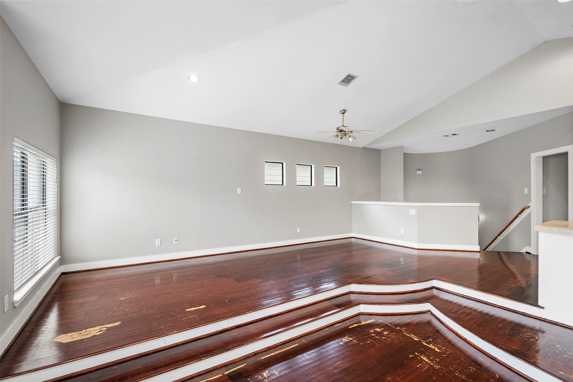 9705 Linkmeadow Lane Houston, TX 77025 - Photo 15 of 32 a view of room with window and wooden floor