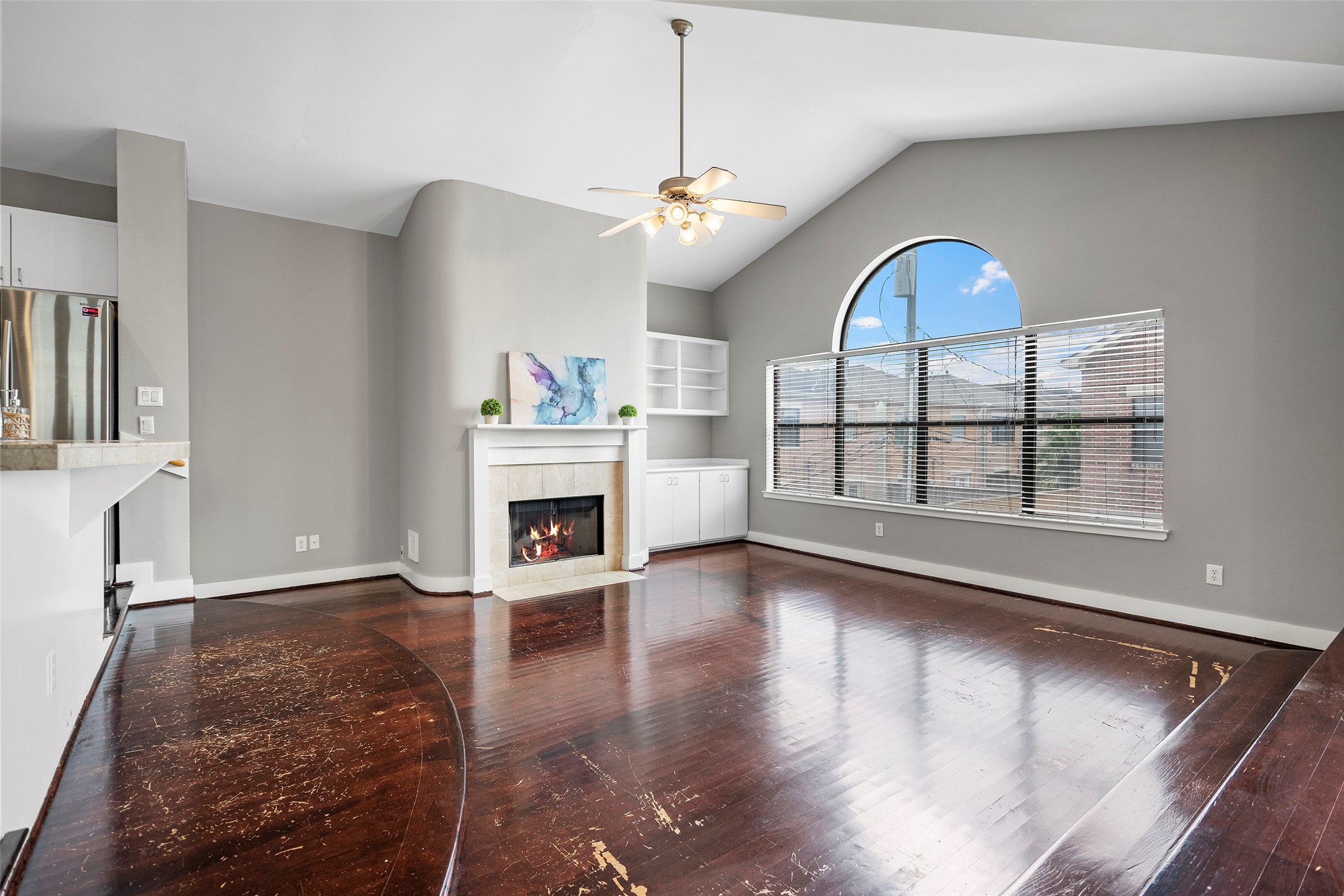 9705 Linkmeadow Lane Houston, TX 77025 - Photo 18 of 32 a view of a livingroom with fireplace wooden floor and chandelier
