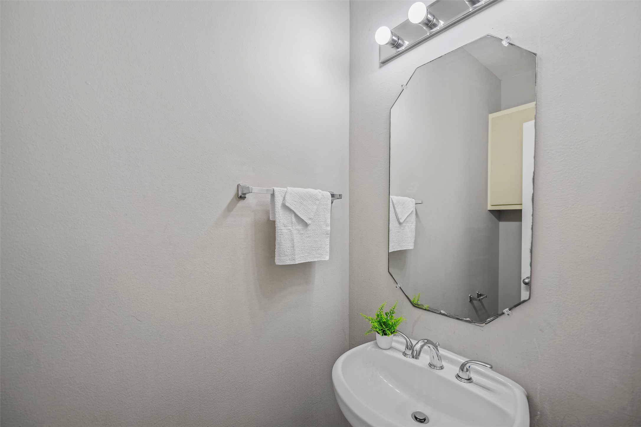 9705 Linkmeadow Lane Houston, TX 77025 - Photo 22 of 32 a bathroom with a sink and mirror with toilet