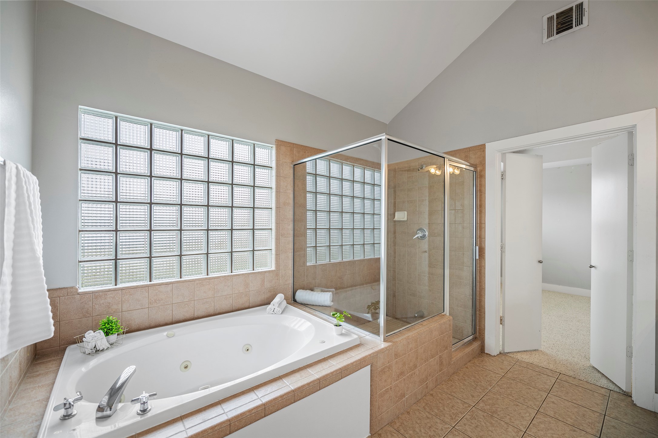 9705 Linkmeadow Lane Houston, TX 77025 - Photo 27 of 32 a bathroom with a tub and a shower