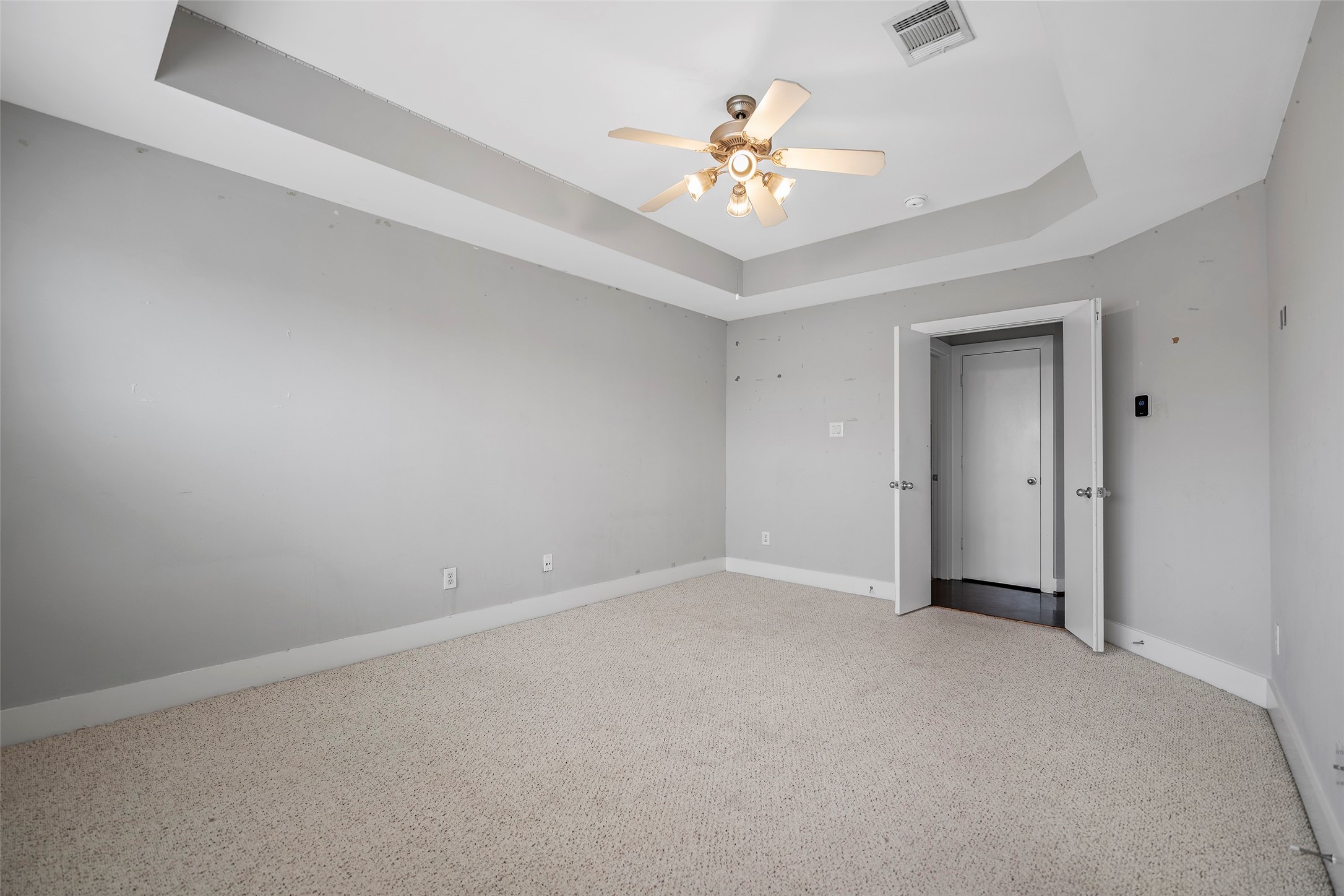9705 Linkmeadow Lane Houston, TX 77025 - Photo 28 of 32 a view of an empty room with a chandelier fan