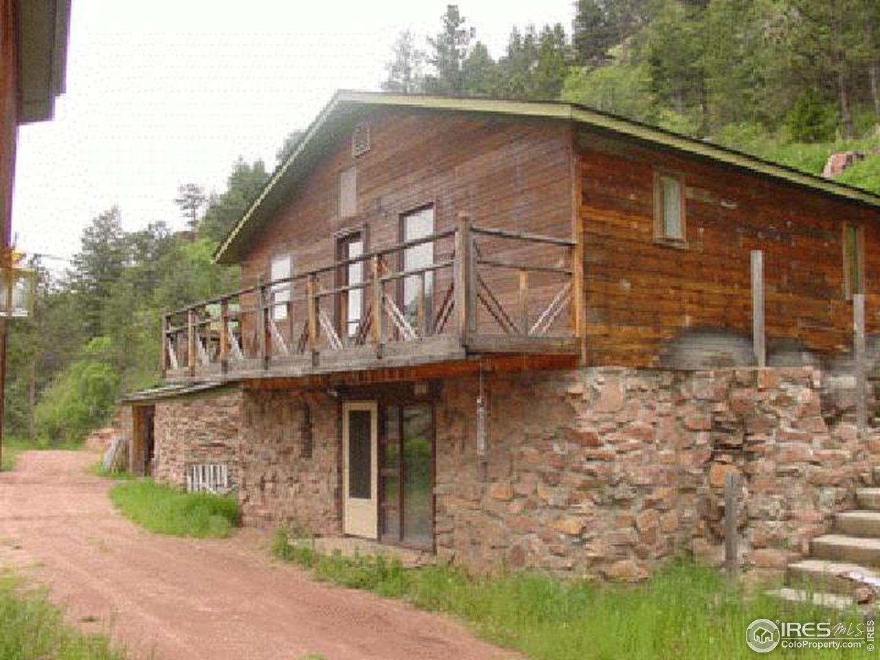 0 Olde Stage Road Boulder, CO 80302 - Photo 2 of 4 a front view of a house with garden