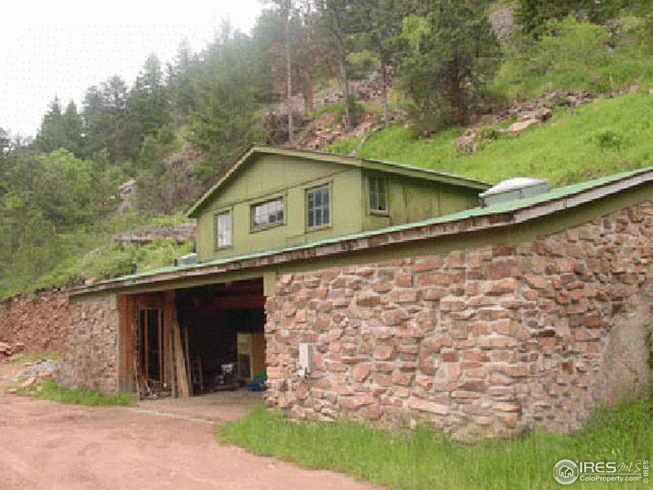 0 Olde Stage Road Boulder, CO 80302 - Photo 3 of 4 a house with trees in the background