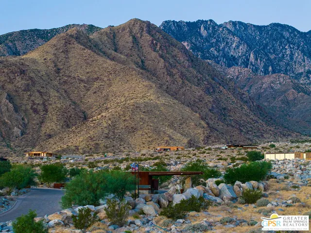 a view of a large building with a mountain in the background